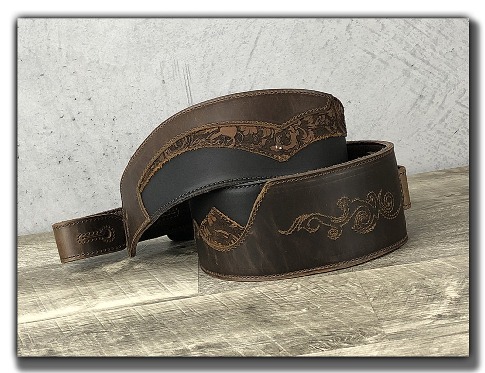 http://www.anthologygearwear.com/cdn/shop/products/leather-guitar-strap-embroidered-brown-coiled.jpg?v=1607291325