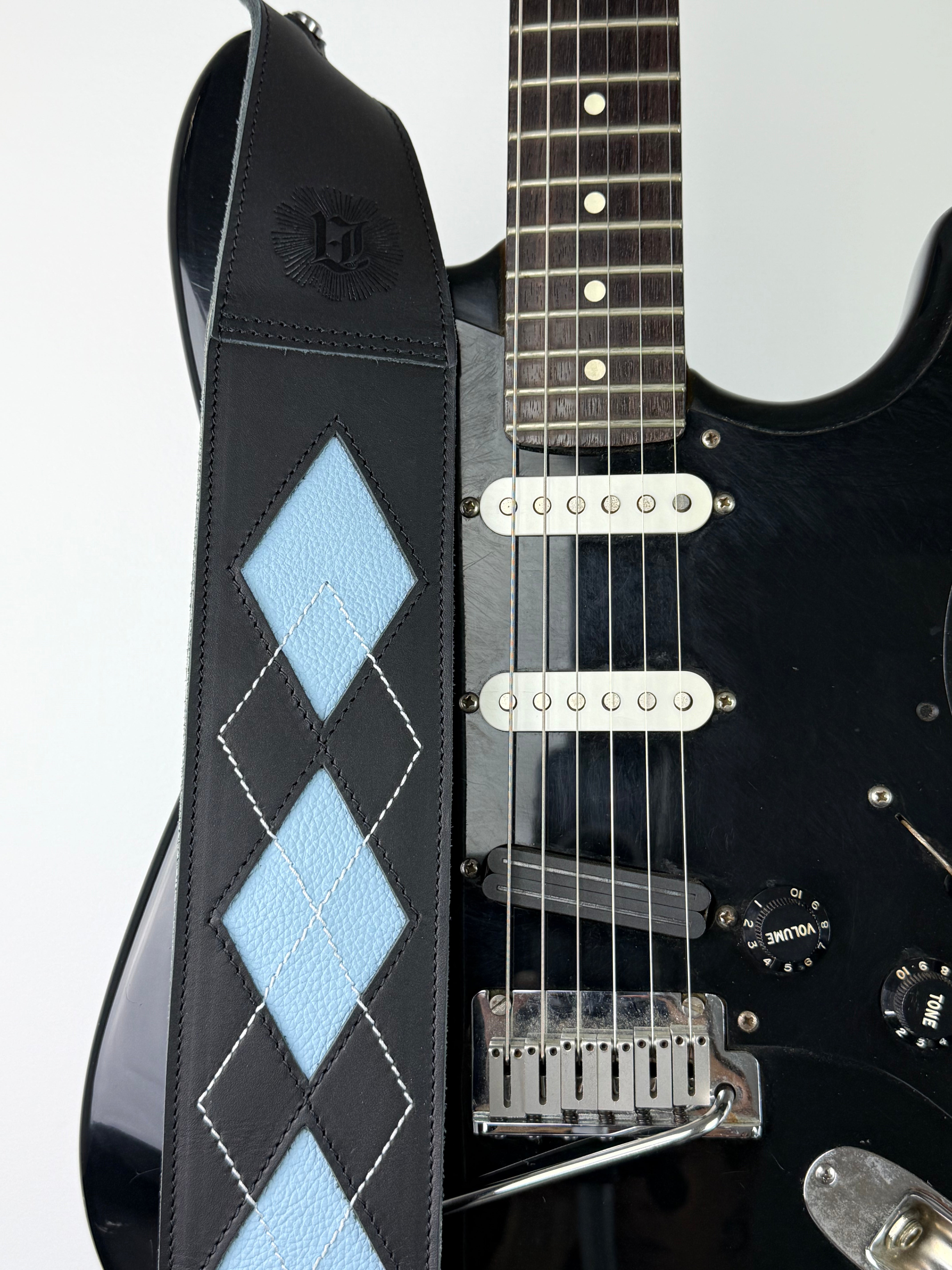 Everett - Carbon Black/Baby Blue Argyle Leather Guitar Strap