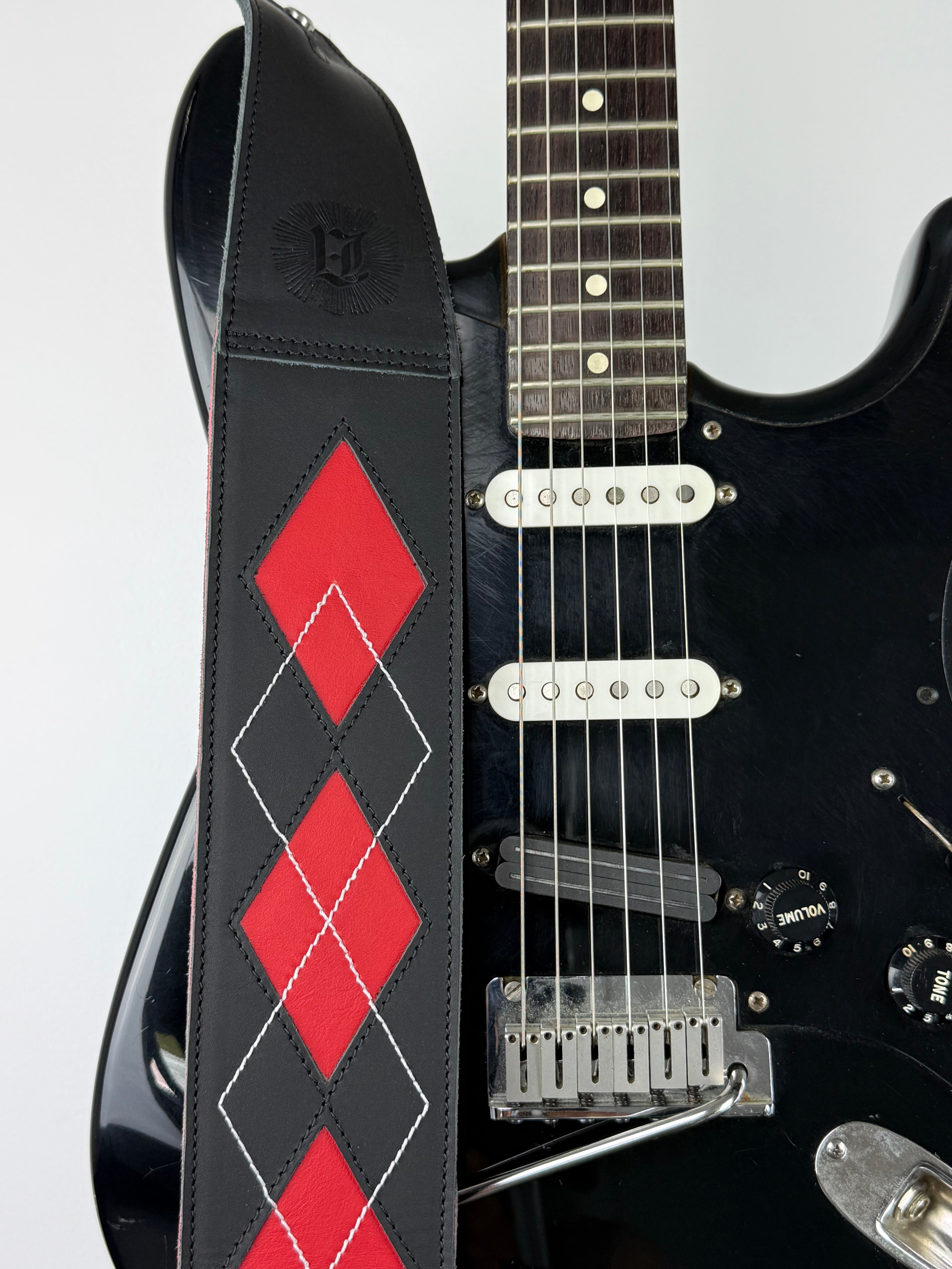 Everett - Carbon Black/Cherry Red Argyle Leather Guitar Strap